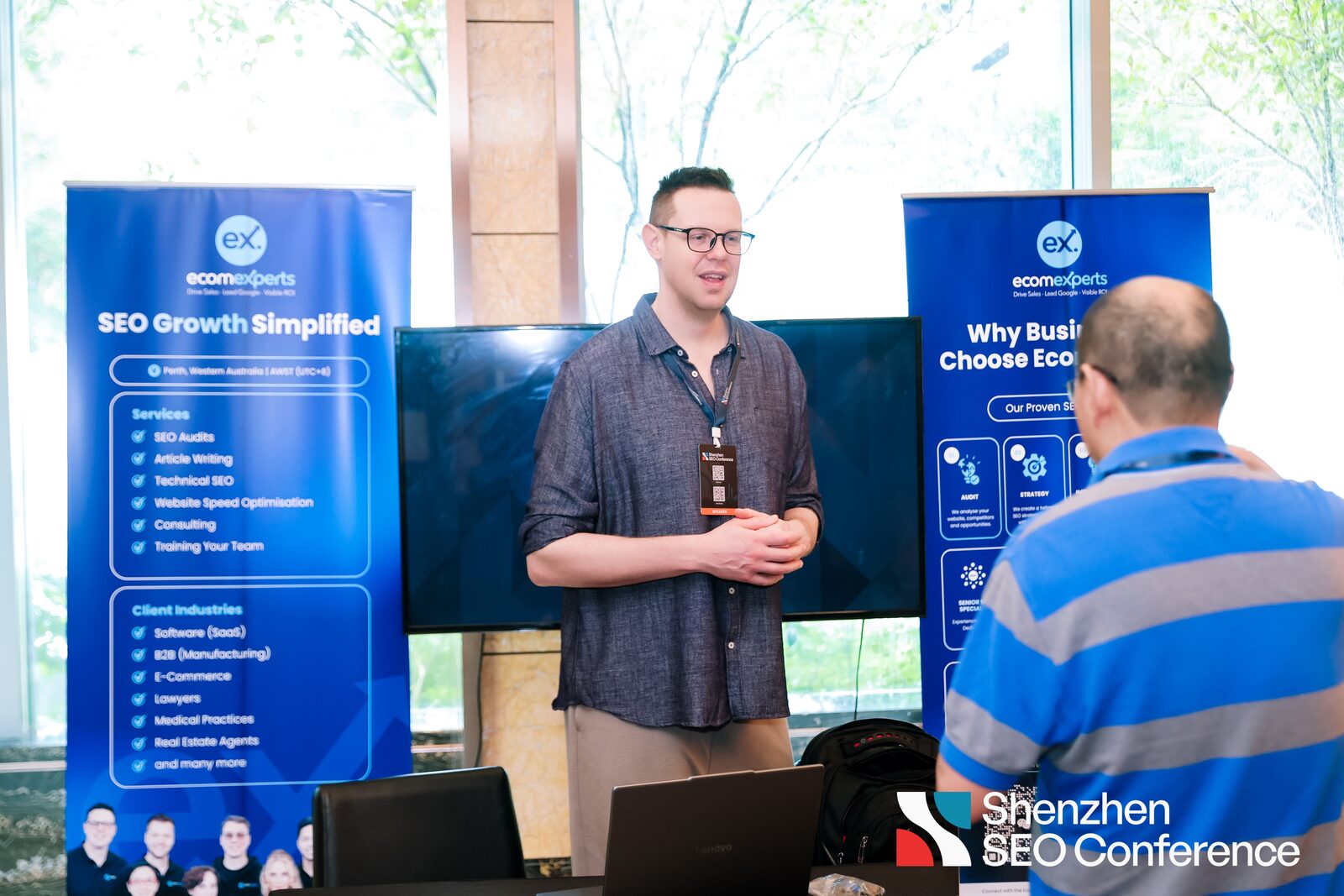 Marc Moeller at the Ecomexperts stand with Perth banners at the Shenzhen SEO Conference 2026