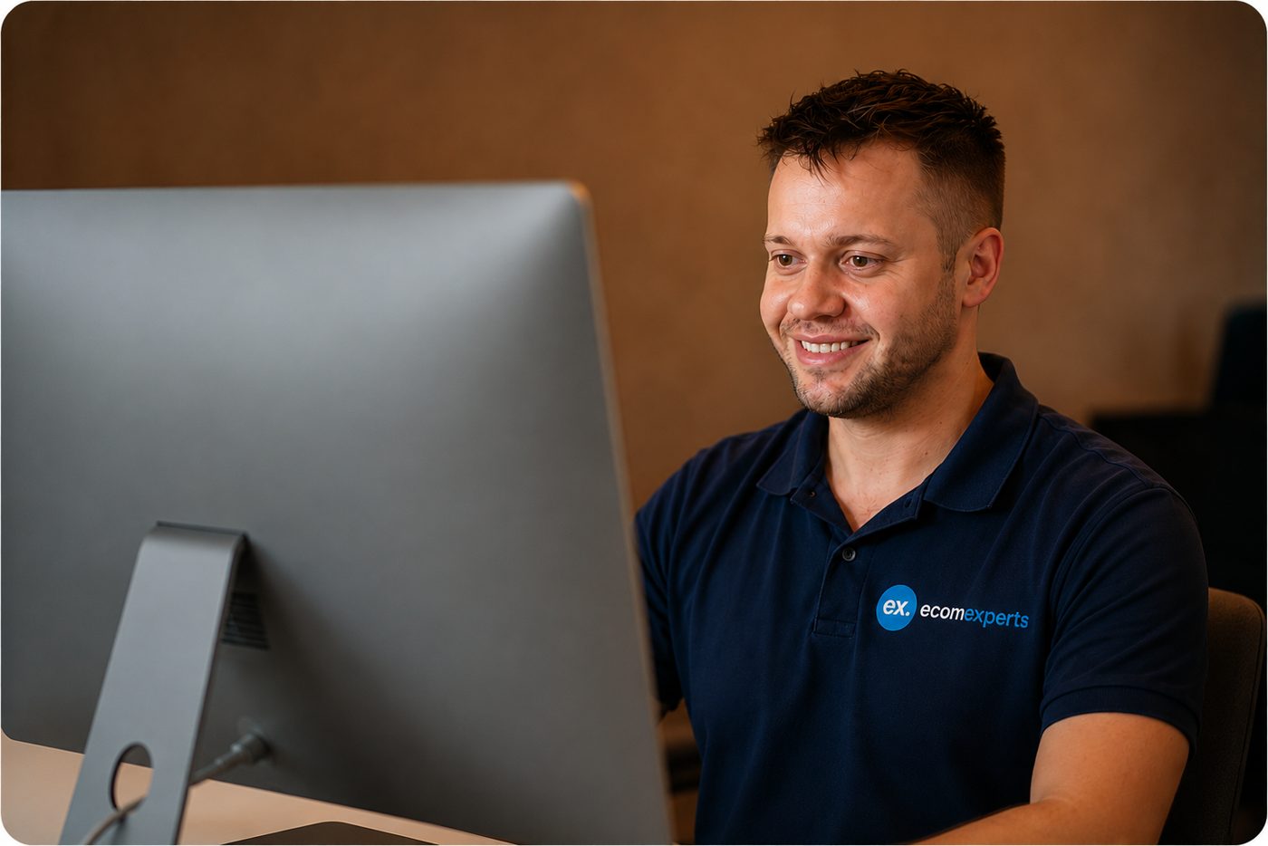 EcomExperts SEO specialist working at a desktop workstation