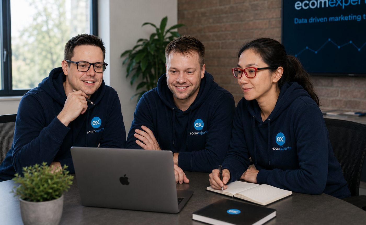 EcomExperts local SEO team collaborating at a laptop