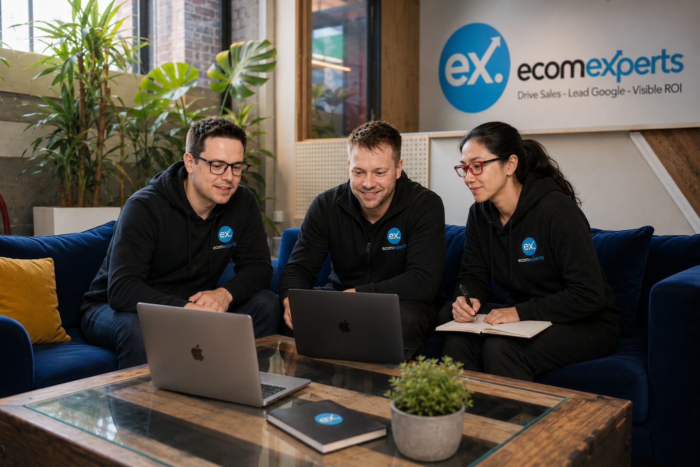 The EcomExperts team reviewing a plumbing SEO campaign together